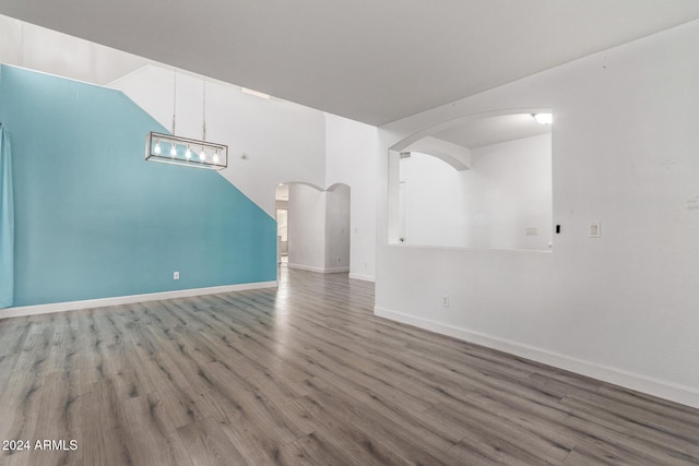 unfurnished living room featuring hardwood / wood-style floors