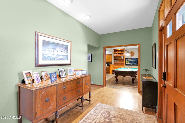 entryway with baseboards, light wood-style floors, and billiards