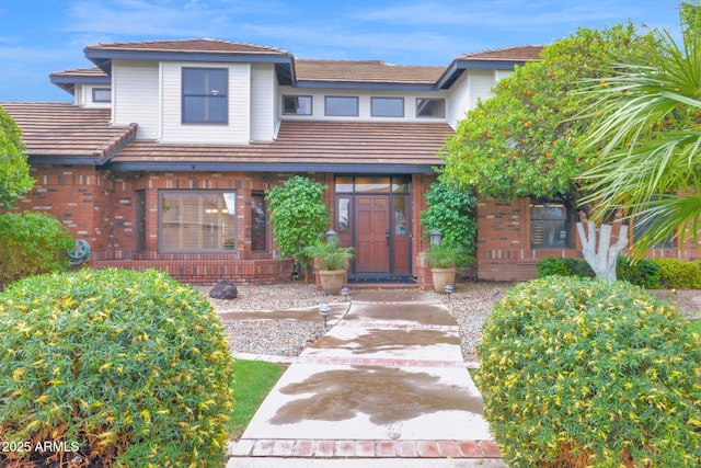 view of front of home featuring brick siding