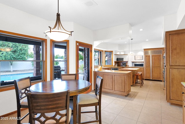 dining room featuring light tile patterned floors and recessed lighting