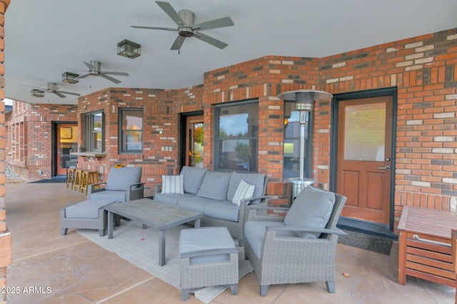 view of patio / terrace with an outdoor living space and a ceiling fan