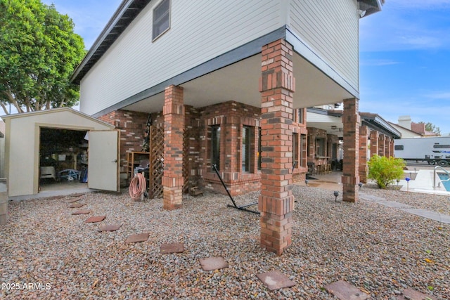 exterior space with brick siding