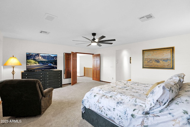 bedroom featuring visible vents, carpet floors, and a ceiling fan