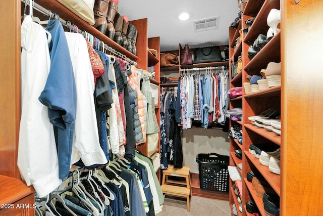 walk in closet with tile patterned floors and visible vents