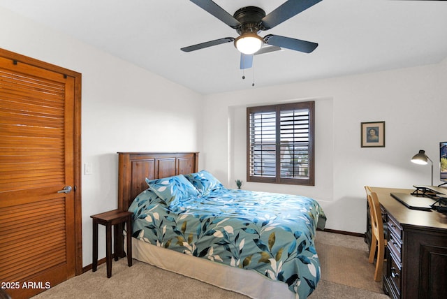 bedroom featuring baseboards, ceiling fan, and carpet flooring