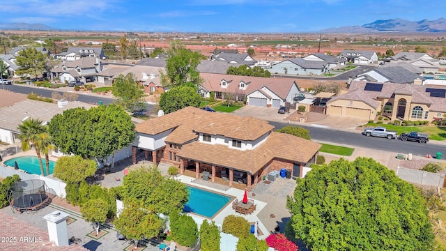 birds eye view of property featuring a mountain view and a residential view