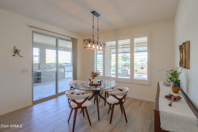 dining room featuring a chandelier and wood-type flooring