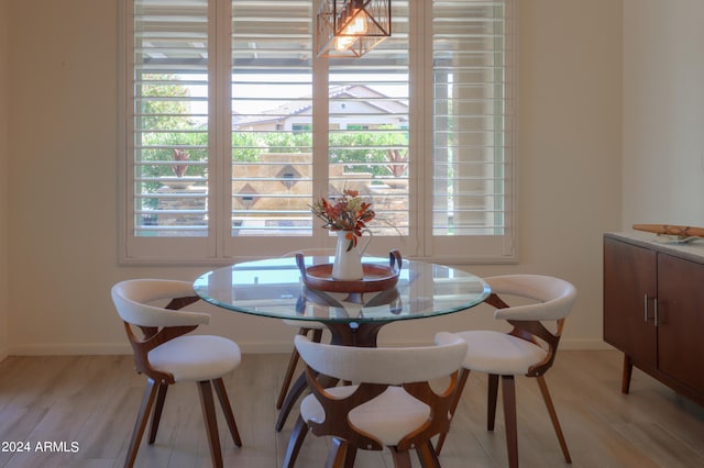 dining area with light hardwood / wood-style flooring