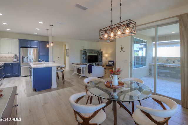 dining space featuring light hardwood / wood-style flooring