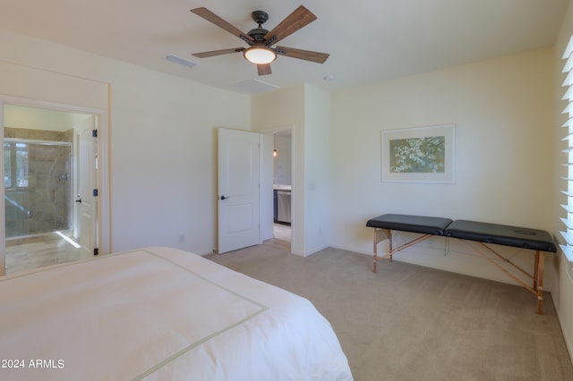 bedroom with ensuite bath, ceiling fan, and light colored carpet