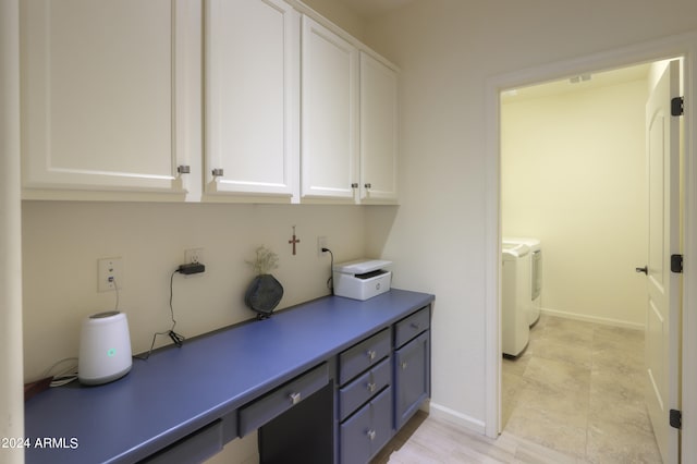 interior space with light tile flooring and washing machine and clothes dryer