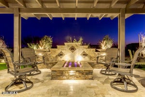 patio terrace at twilight featuring a pergola