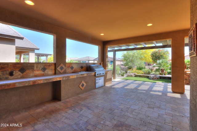 view of patio / terrace with exterior kitchen and grilling area