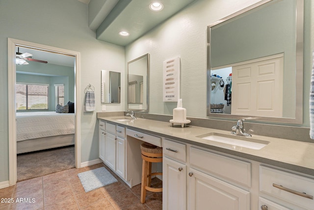 bathroom with ceiling fan, vanity, and tile patterned flooring