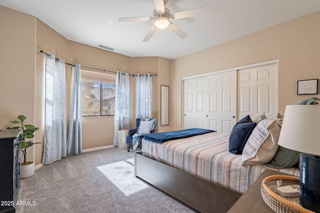 bedroom featuring light carpet and ceiling fan