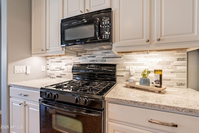 kitchen with light stone counters, white cabinets, black appliances, and tasteful backsplash