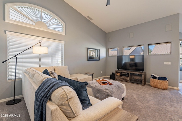 living room with carpet floors and high vaulted ceiling