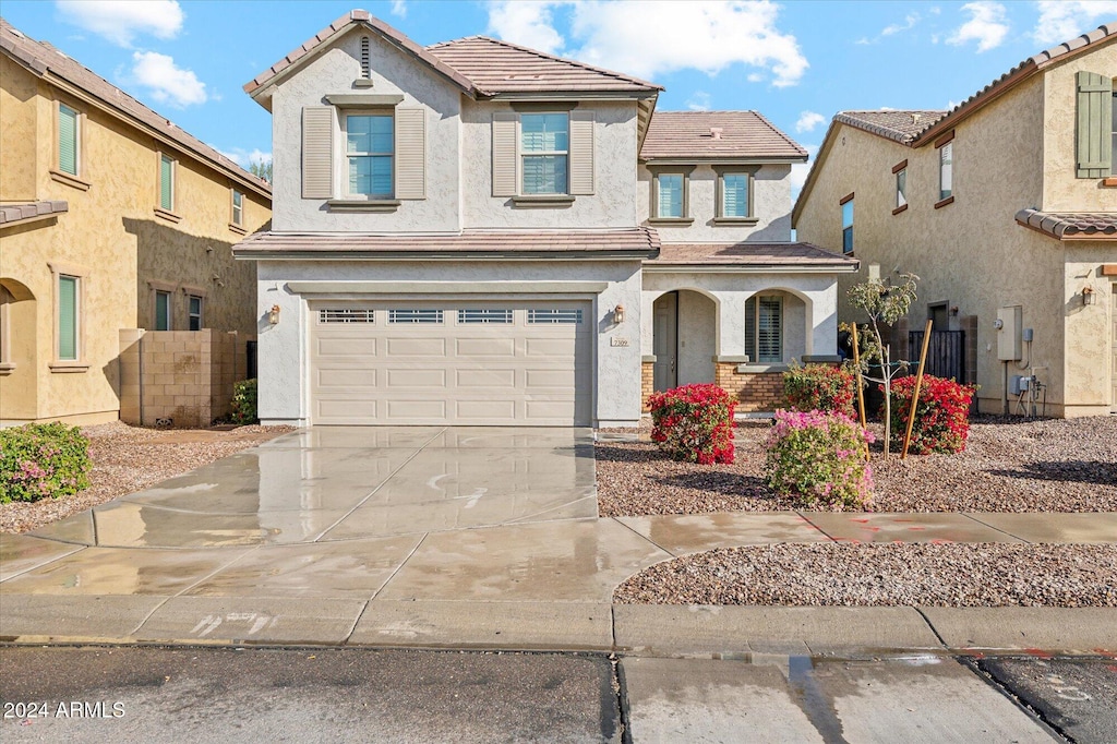 view of front of home with a garage