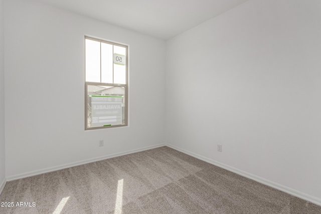 unfurnished room featuring plenty of natural light and light colored carpet