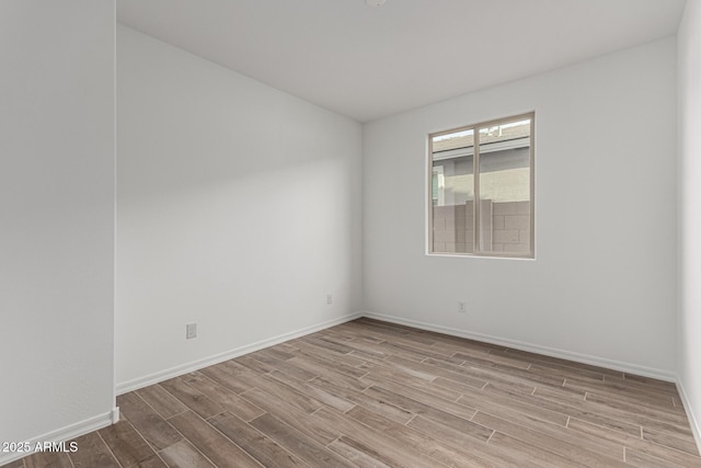 unfurnished room featuring light hardwood / wood-style floors