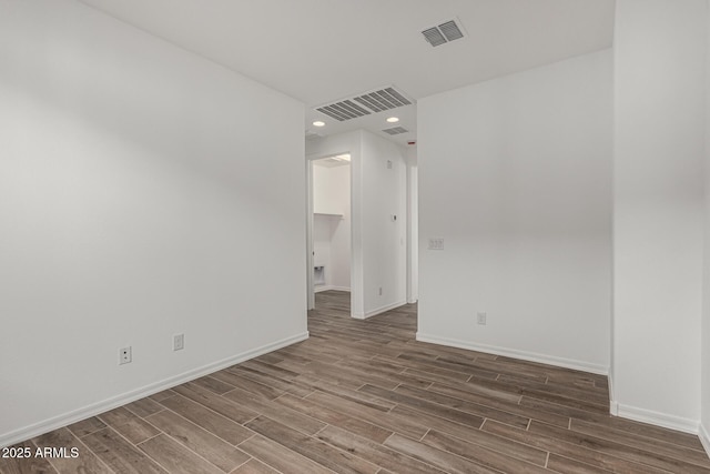 unfurnished room featuring wood-type flooring