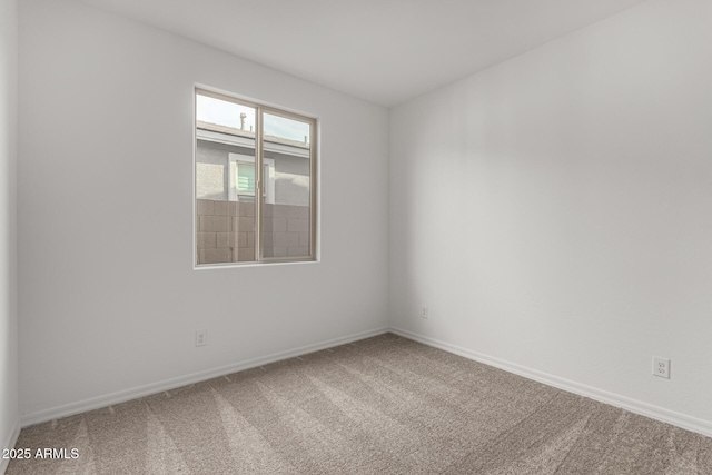 spare room featuring carpet floors