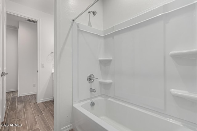 bathroom with shower / bathtub combination