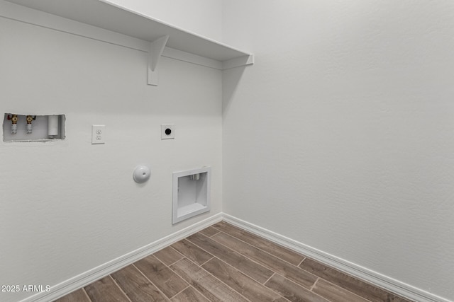 clothes washing area featuring hookup for an electric dryer, hookup for a washing machine, and gas dryer hookup