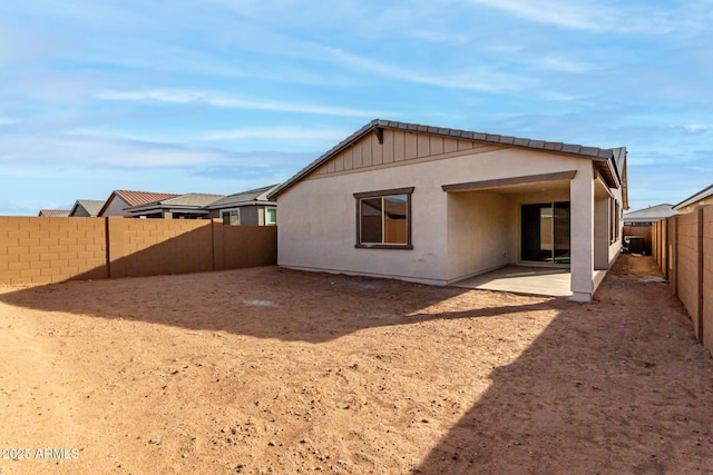 rear view of house featuring a patio area