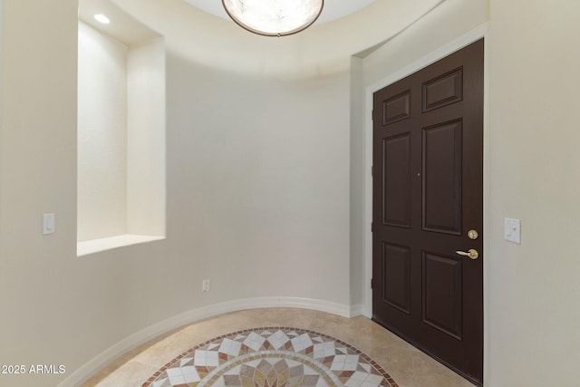 foyer entrance with baseboards