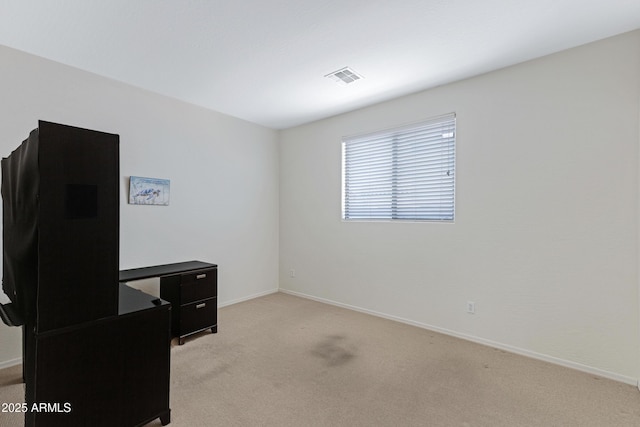 office area featuring light carpet, baseboards, and visible vents