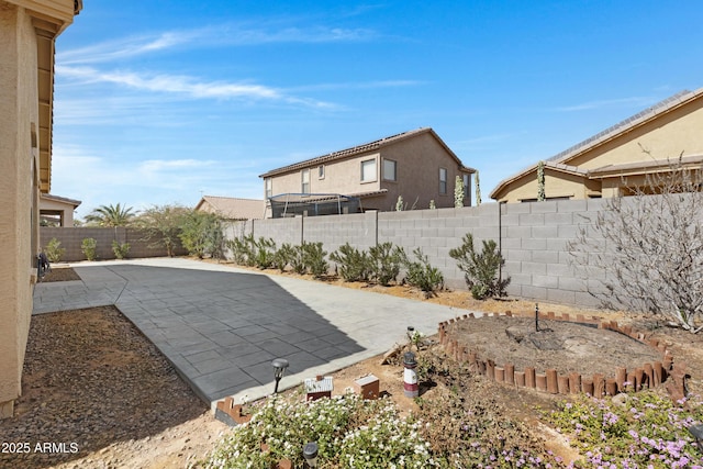 view of yard with a patio area and a fenced backyard