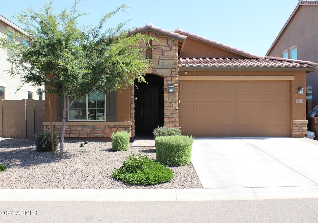 view of front of property with a garage