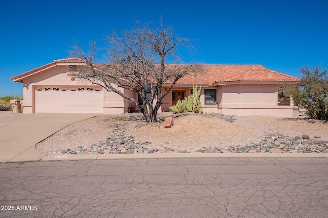 17038 E Rand Dr, Fountain Hills, AZ 85268 - view of front of property with a tile roof, stucco siding, an attached garage, and concrete driveway