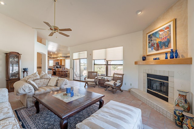 17038 E Rand Dr, Fountain Hills, AZ 85268 - living area featuring light tile patterned flooring, ceiling fan, high vaulted ceiling, and a brick fireplace