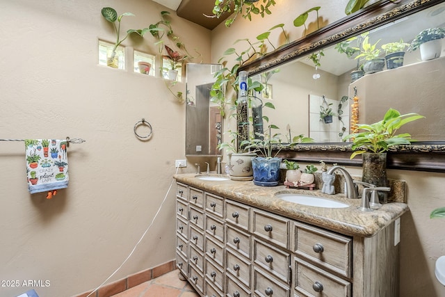 bathroom with tile patterned flooring and vanity