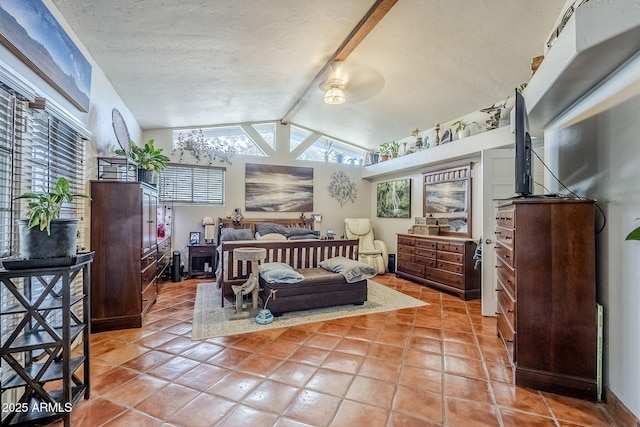 bedroom featuring light tile patterned floors, lofted ceiling with beams, and a textured ceiling