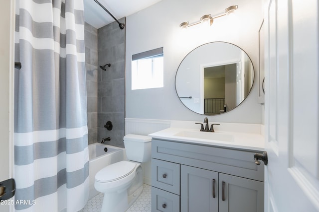 bathroom featuring toilet, tile patterned flooring, shower / bathtub combination with curtain, and vanity