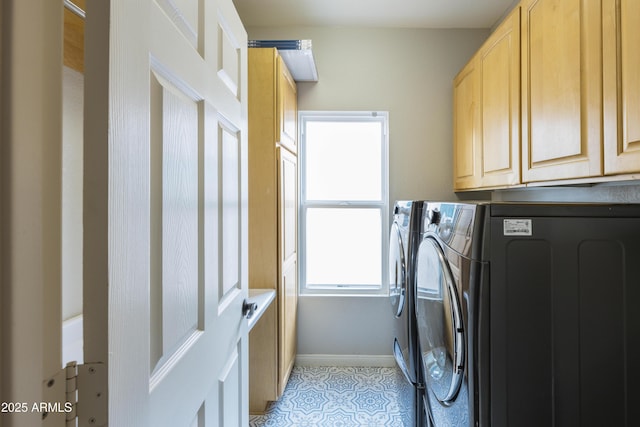 washroom with cabinet space, light tile patterned flooring, baseboards, and independent washer and dryer