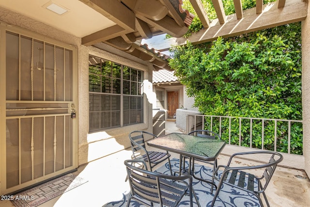 view of patio / terrace featuring outdoor dining area and a pergola