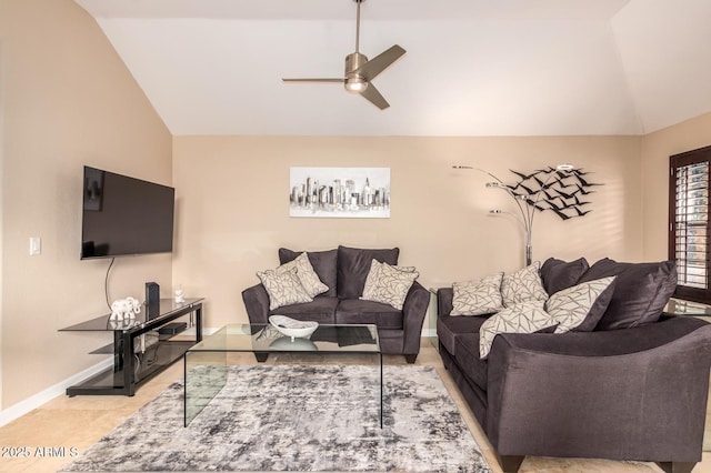 living room with vaulted ceiling, ceiling fan, light tile patterned flooring, and baseboards