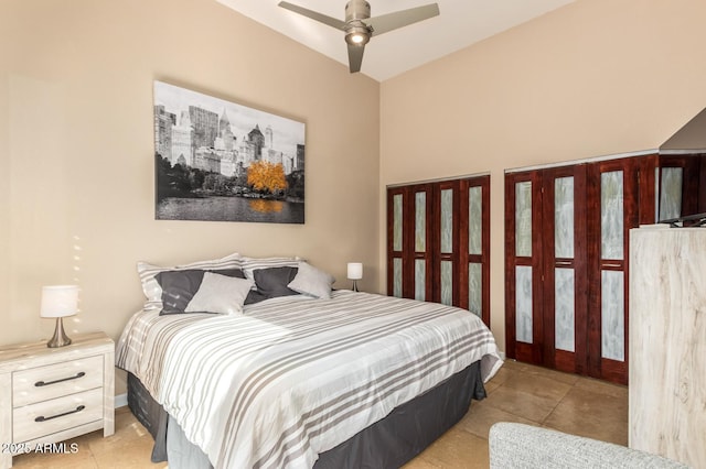 bedroom with a ceiling fan and light tile patterned flooring