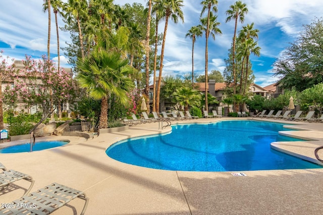 community pool featuring a patio area