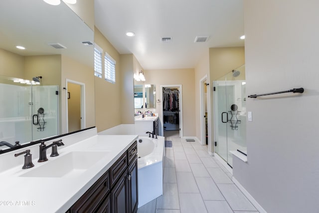 bathroom with separate shower and tub, vanity, and tile patterned floors