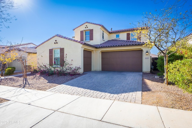 mediterranean / spanish-style home featuring a garage