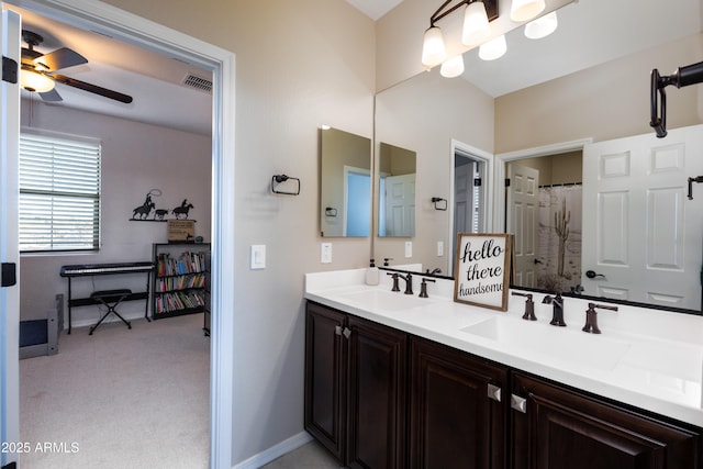 bathroom with ceiling fan and vanity