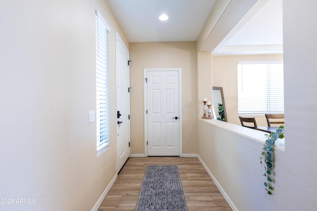 doorway to outside with light hardwood / wood-style floors