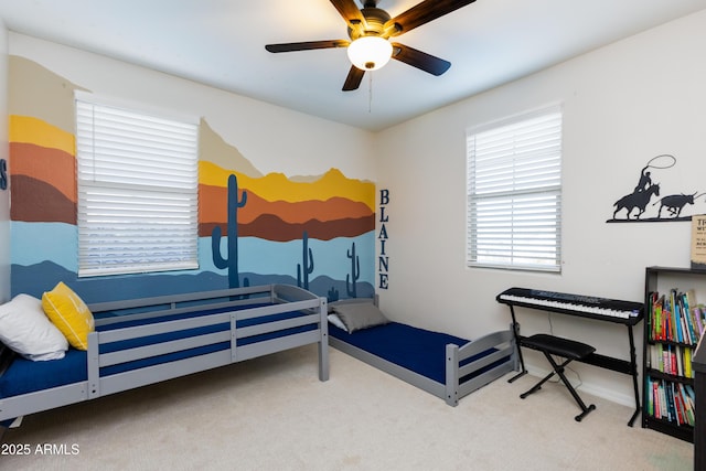 bedroom featuring light carpet and ceiling fan