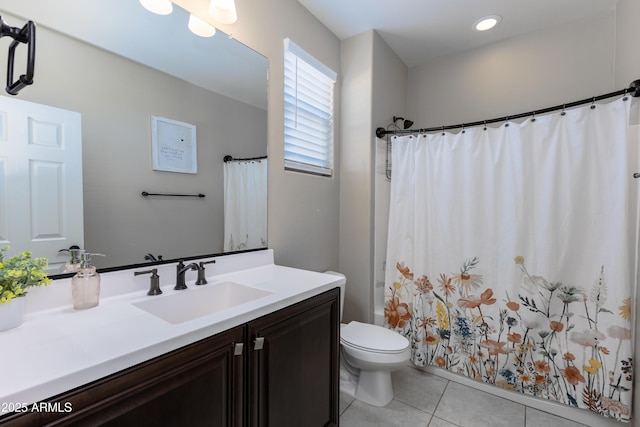 bathroom featuring toilet, tile patterned flooring, curtained shower, and vanity