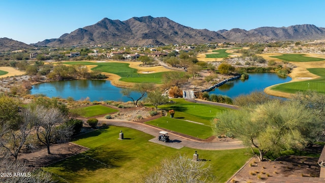 drone / aerial view featuring a water and mountain view